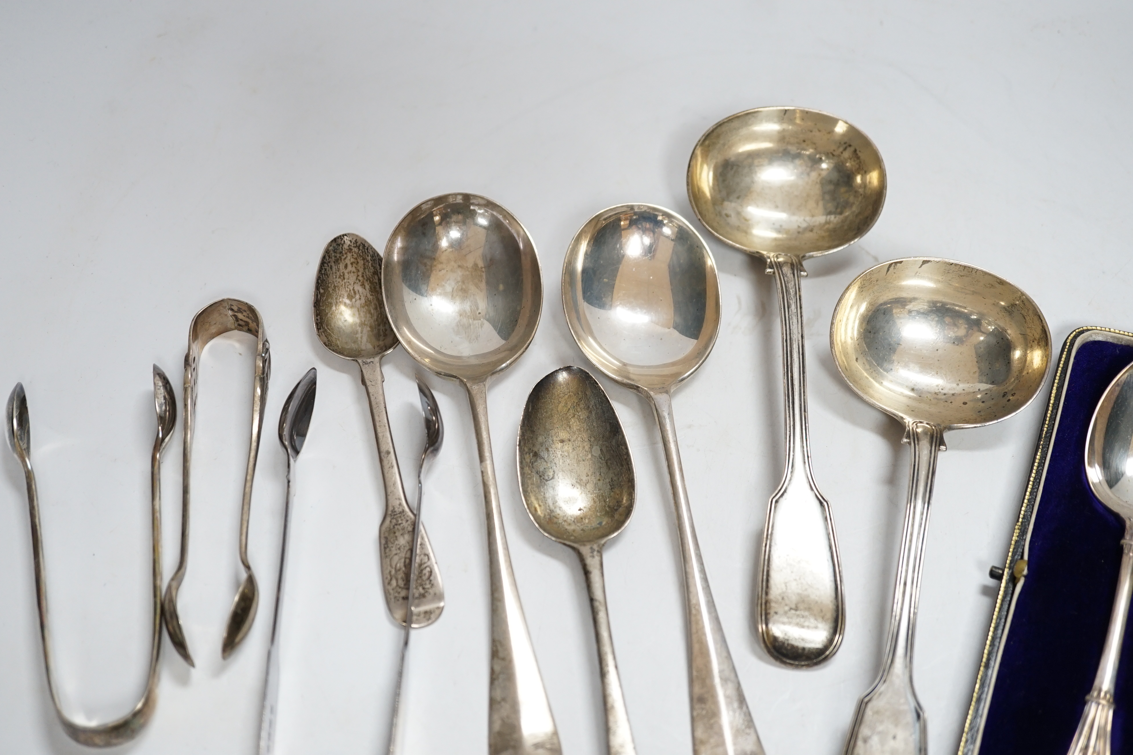 A small group of assorted silver flatware, including pair of fiddle and thread pattern sauce ladles, Elizabeth Eaton, London, 1848